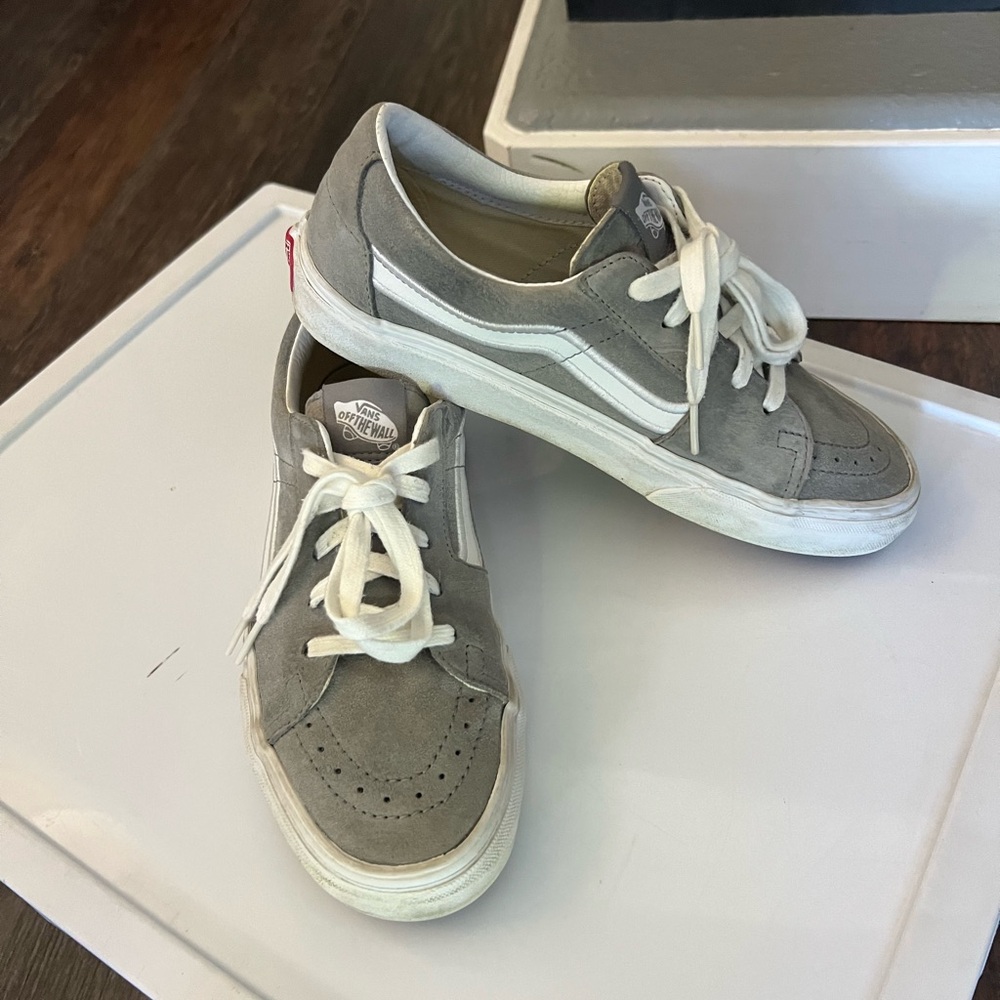 Gray and White suede old school style vans of the wall